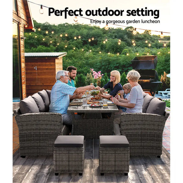 Outdoor dining couple enjoying wine at gardeon 8 seater wicker table chairs - grey