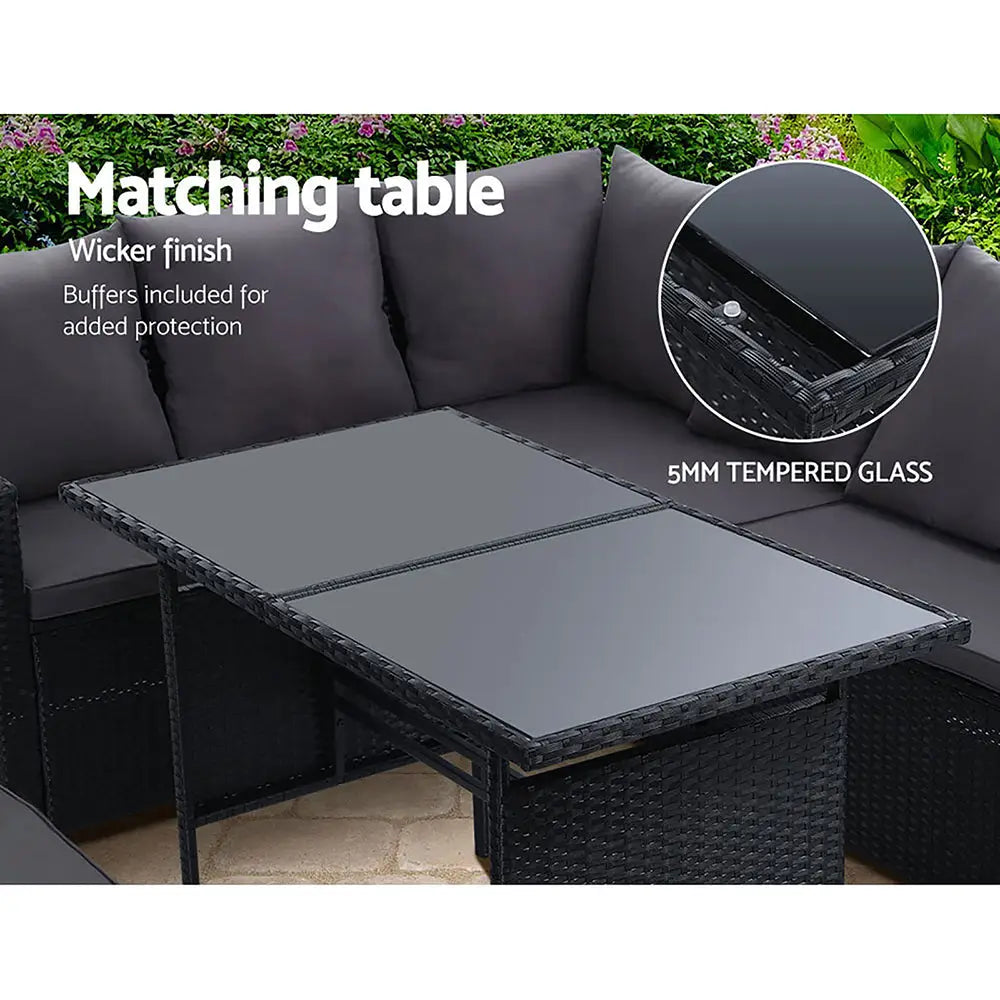 Gardeon 8 seater outdoor sofa dining set with laptop on table
