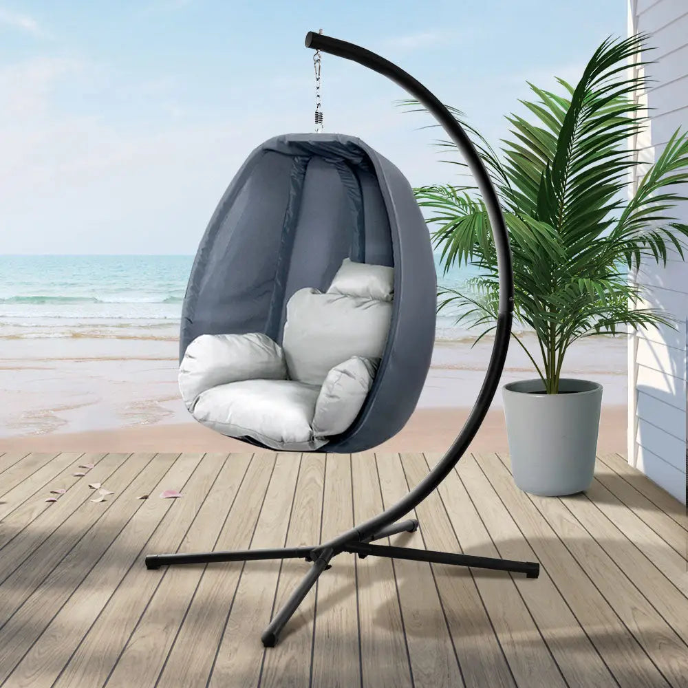 Gardeon hanging pod chair on wooden deck, powder-coated steel frame