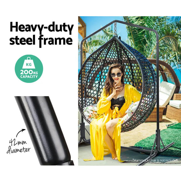 Woman sitting in full-frame hammock chair with black cover - gardeon hammock chair steel stand 2 person double outdoor heavy duty 200kg