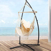 Gardeon hammock chair with tassels and steel stand on wooden deck
