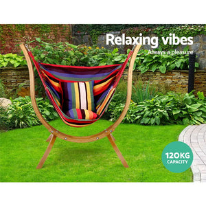 Gardeon timber hammock chair swaying gently amidst garden, lazy sunday