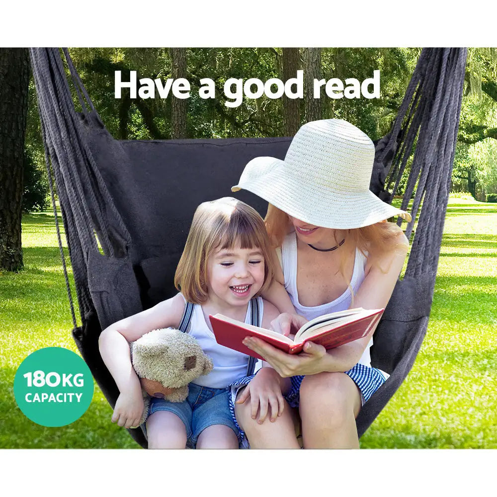 Mother and child enjoying a book in gardeon hanging hammock chair with cushion, featuring timber rail and polyester cotton fabric