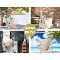 Gardeon hanging hammock chair with tassels featuring woman sitting, timber rail