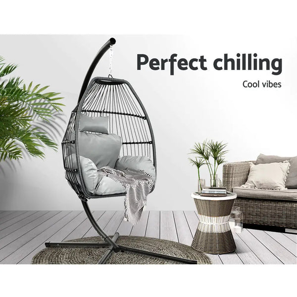 Gardeon hanging pod chair with cushion and plant