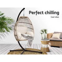 Gardeon hanging pod chair with plant in background