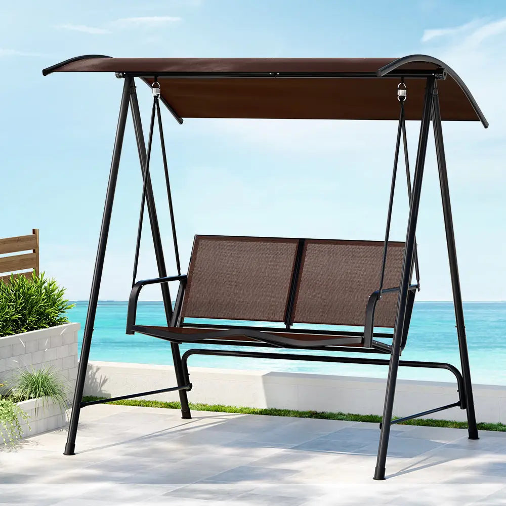 Gardeon outdoor steel swing chair with removable canopy - 2 seater on beach