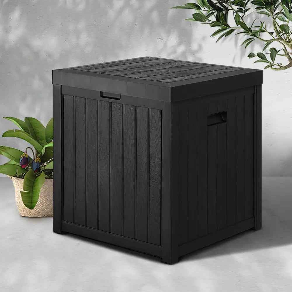 Gardeon outdoor storage box 195l - black with plant background