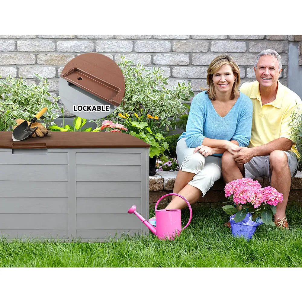 Gardeon outdoor storage box 290l lockable - couple sitting by garden box