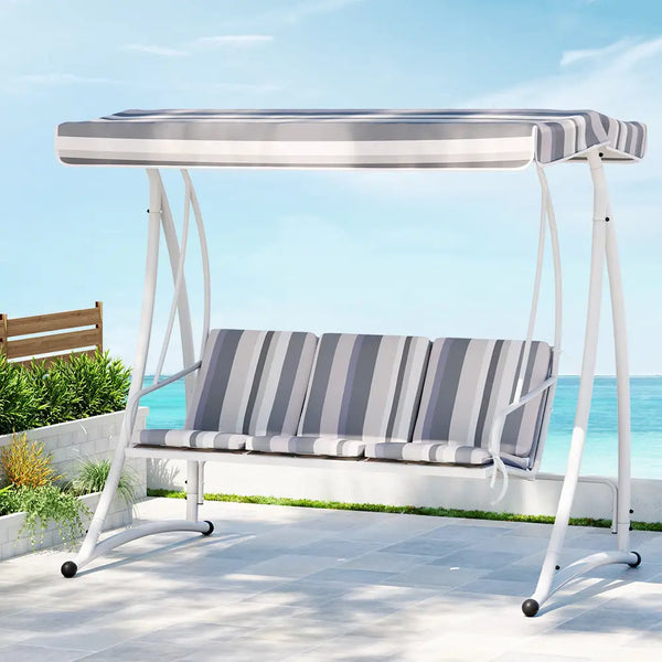 Gardeon white swing chair with canopy on patio