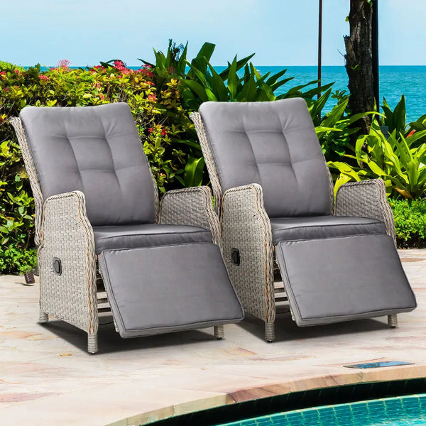 Gardeon wicker recliner chairs by the pool with ocean view