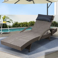 Gardeon sun lounge with adjustable armrest beside a pool