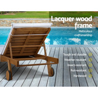 Outdoor wooden sun lounge chair with white cushion for summer relaxation