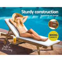 Woman lounging in sun lounger with drink by gardeon sun lounge wooden lounger outdoor with seat cushion