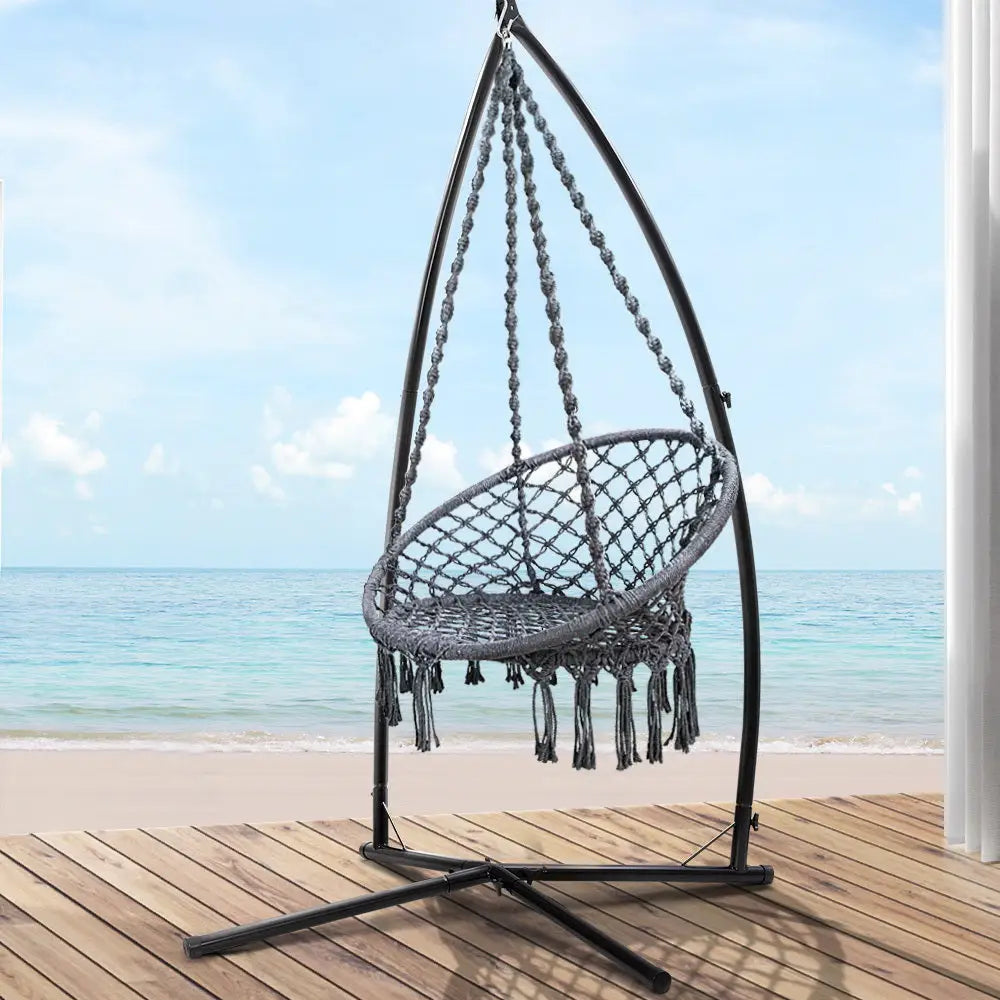 Gardeon woven hammock chair with steel stand overlooking ocean