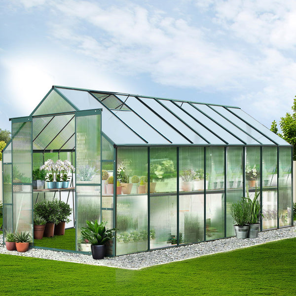 Close-up of greenfingers aluminium greenhouse filled with lush plants, ideal for any garden