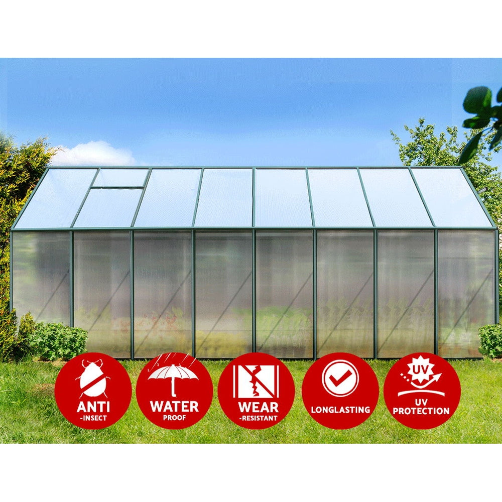 A close-up of greenfingers aluminium greenhouse with multiple signs and polycarbonate panels