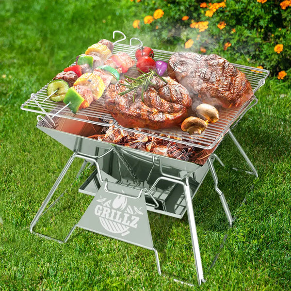 Stainless steel pit bbq grill with meat, carry bag included