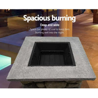 Grillz fire pit table square 55cm with saus burning on mesh dome