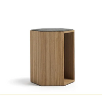 Wooden side table with a black top on a white background