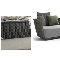 Outdoor furniture set with wicker design and cushions, featuring text in Chinese.