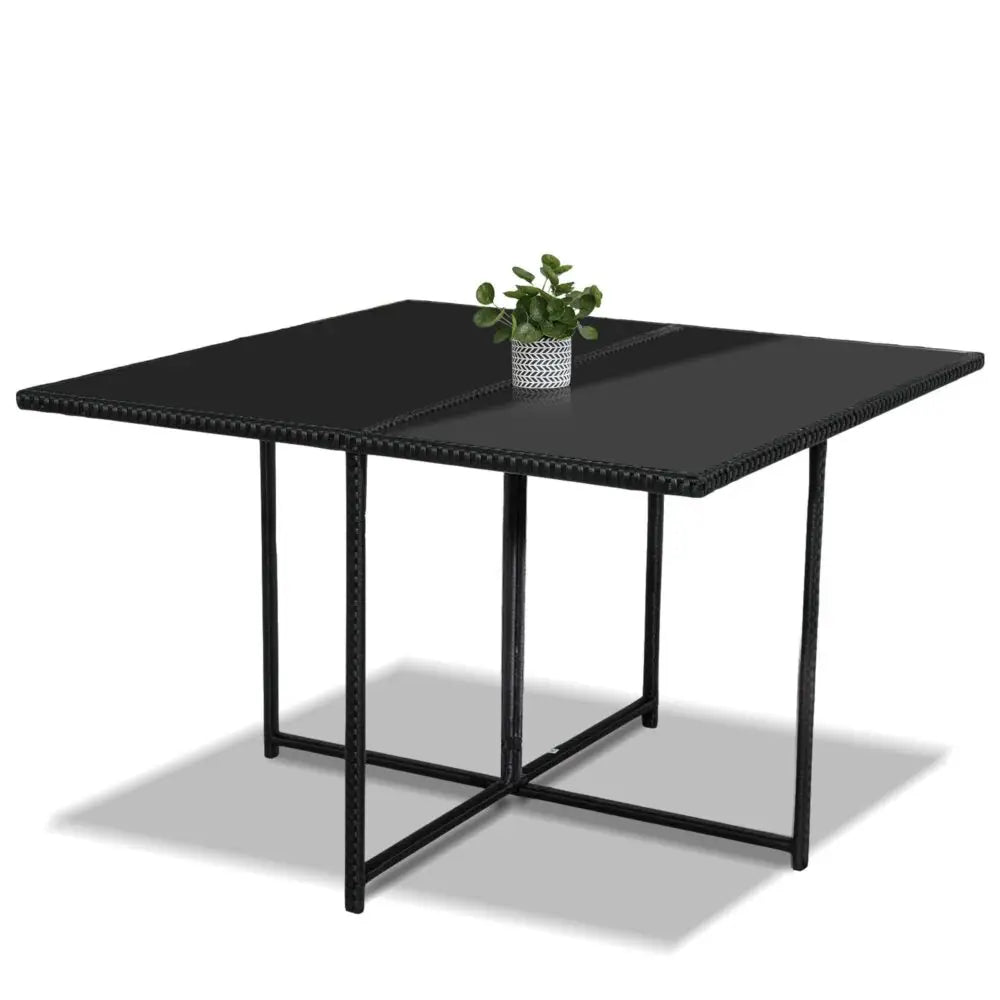 Rattan garden furniture - black table with plant on top from ’horrocks 8 seater outdoor dining set’
