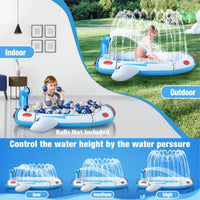 Child playing in the inflatable sprinkler pool for kids - spaceship