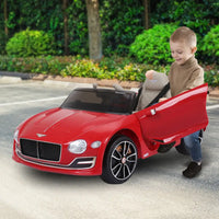 Child playing with kahuna bentley exp 12 speed 6e electric ride on car