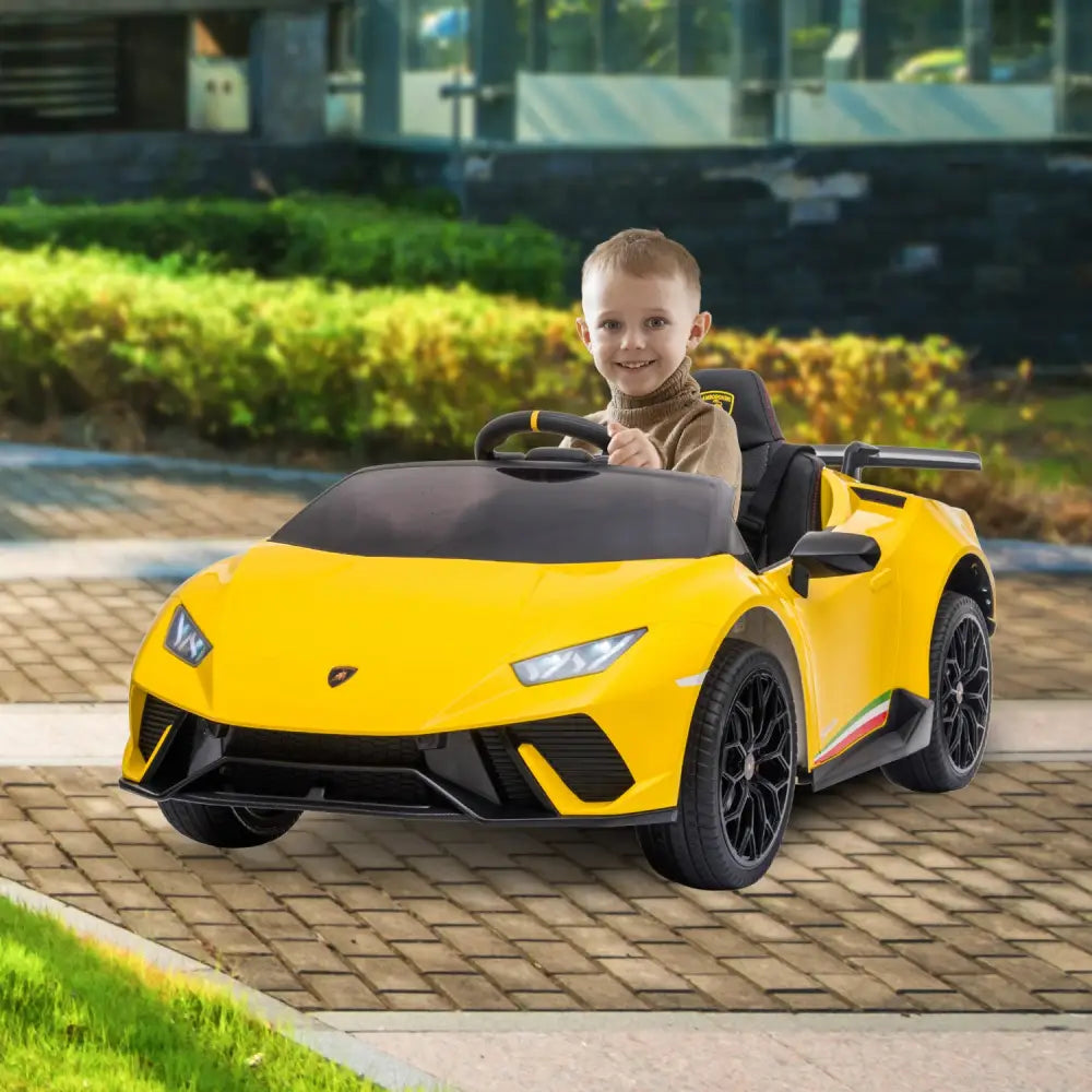 Little boy driving yellow lamborghini performante kids electric ride on car with remote control