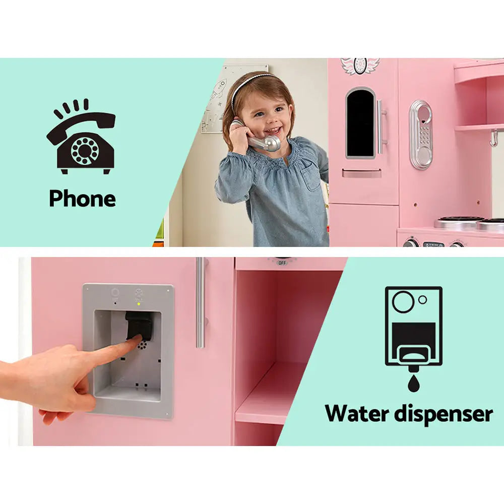 Keezi kids kitchen play set - child’s hand holding phone and phone in wall