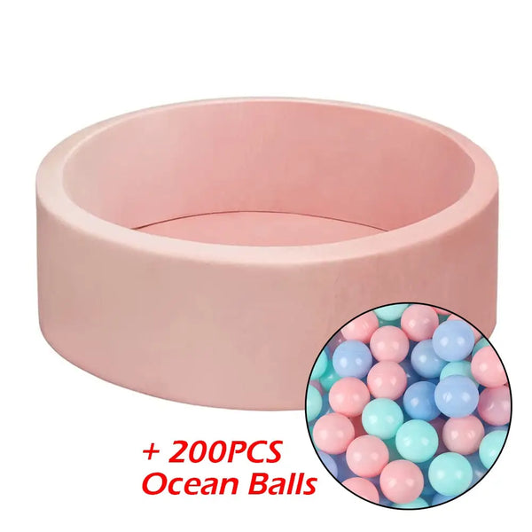 Pink plastic bowl filled with colorful ocean balls from keezi kids ocean ball pit + 200pcs macaron ocean balloons