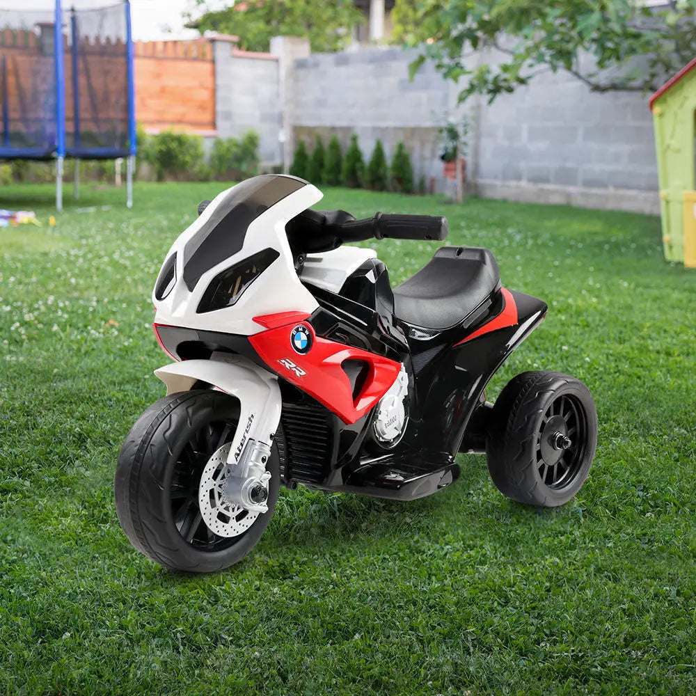 Bmw licensed s1000rr kids electric ride on police motorcycle parked in the grass