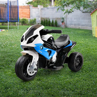 Licensed bmw s1000rr electric ride on police motorcycle parked in grass
