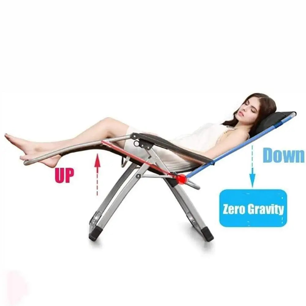 Woman relaxing on kingsize outdoor folding reclining sunlounger with zero gravity position