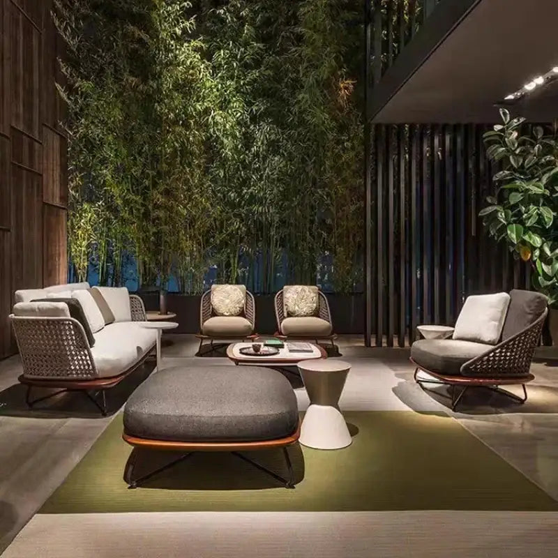 Modern outdoor seating area with furniture and plants in a stylish setting