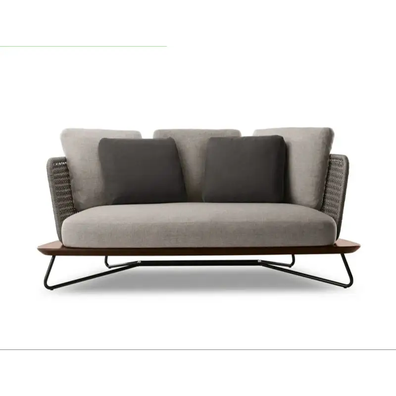 Gray outdoor sofa with dark cushions on a white background, featuring the Dilai Garden brand.