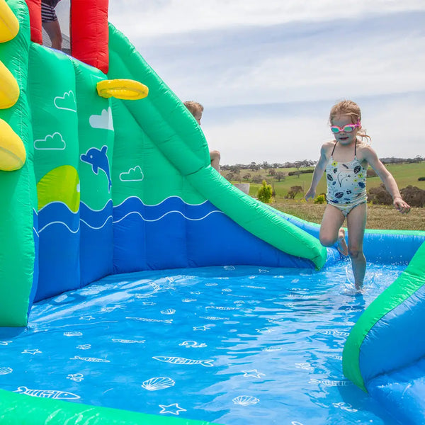 Little girl jumping in lifespan kids atlantis slide & splash pool