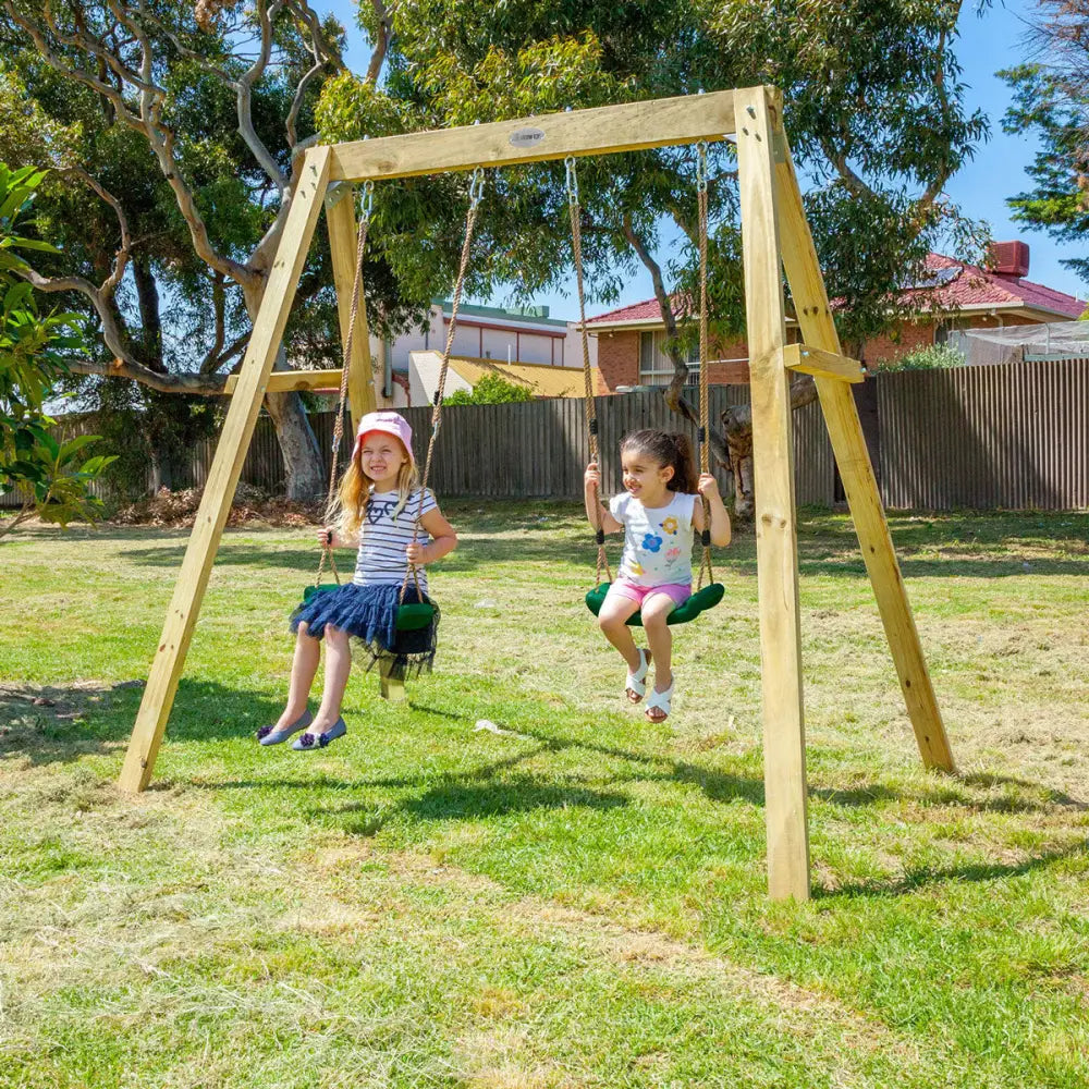 Two kids happily playing on a swing frame from lifespan kids holt double swingset