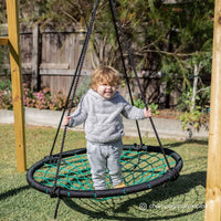 Toddler playing on spidey web swing from lifespan kids oakley swing set