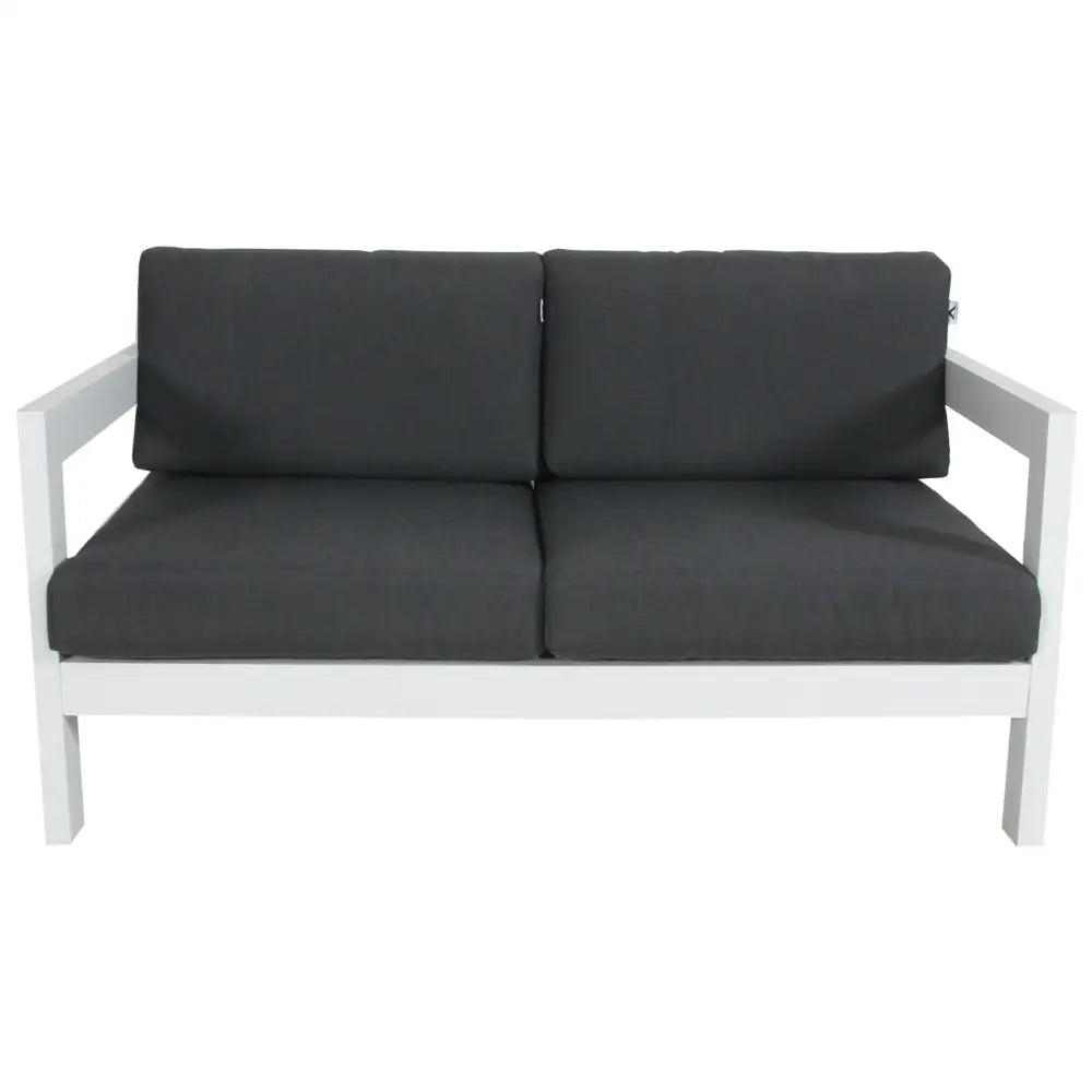 White wooden 3-seater outdoor sofa with black cushions in ’outie 2 or 3 seater outdoor sofa lounge aluminium frame - white’