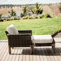 Paradise armchair and ottoman on wooden deck