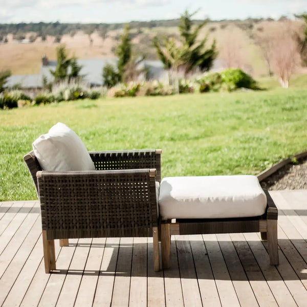 Paradise armchair and ottoman on wooden deck