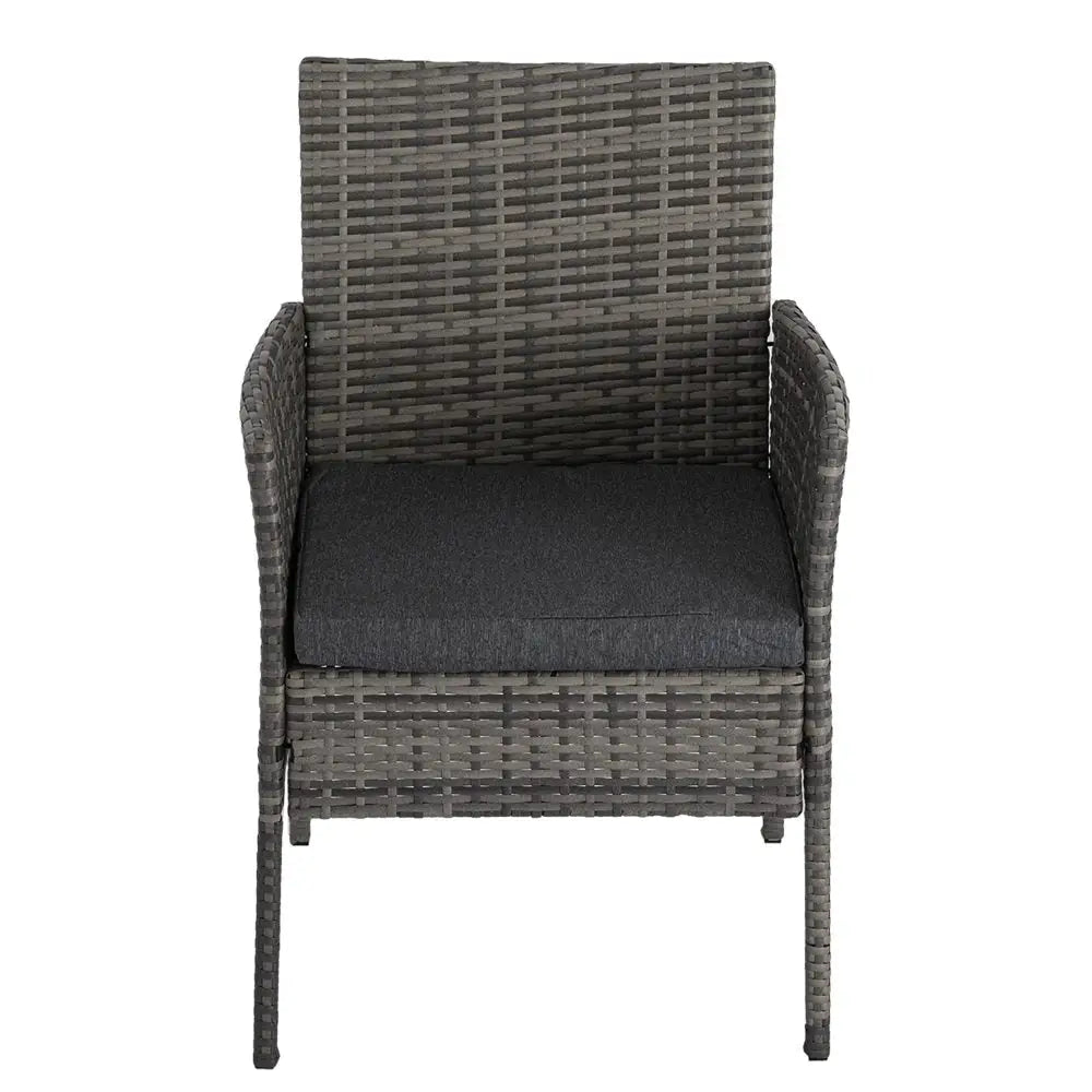 Outdoor dining set featuring a gray wicker chair with black cushion