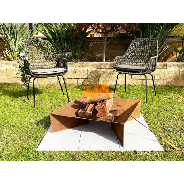Rustic steel fire pit with fire, poker, and wooden handle, 70cm square