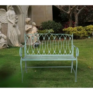 Sage sacha wrought iron bench in garden with statues