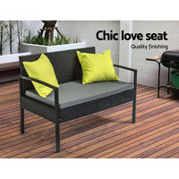 Saipan outdoor sofa set with yellow cushion patio chair on a wooden deck