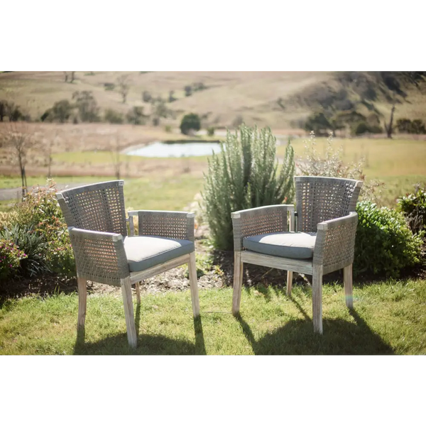 Classic high back wicker chairs by the pond - holiday vibes